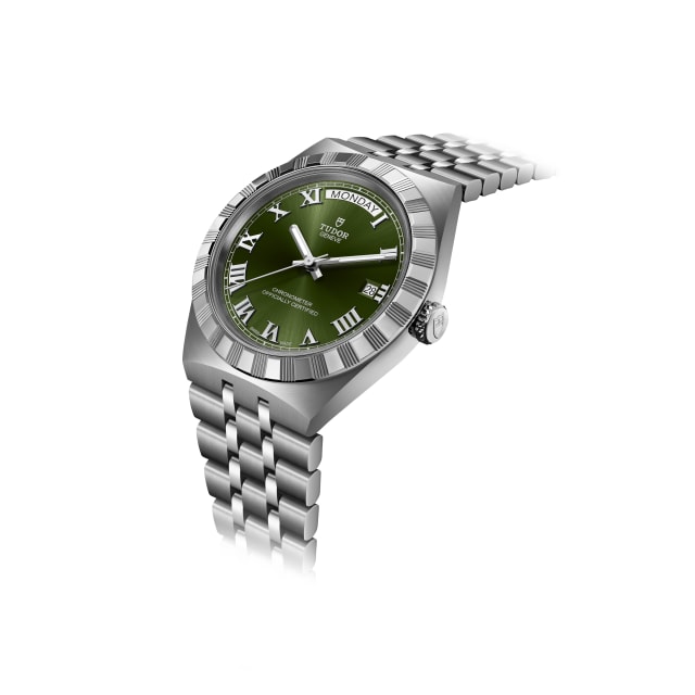 Close-up detail of Tudor Royal green Roman numeral dial day window and polished bezel
